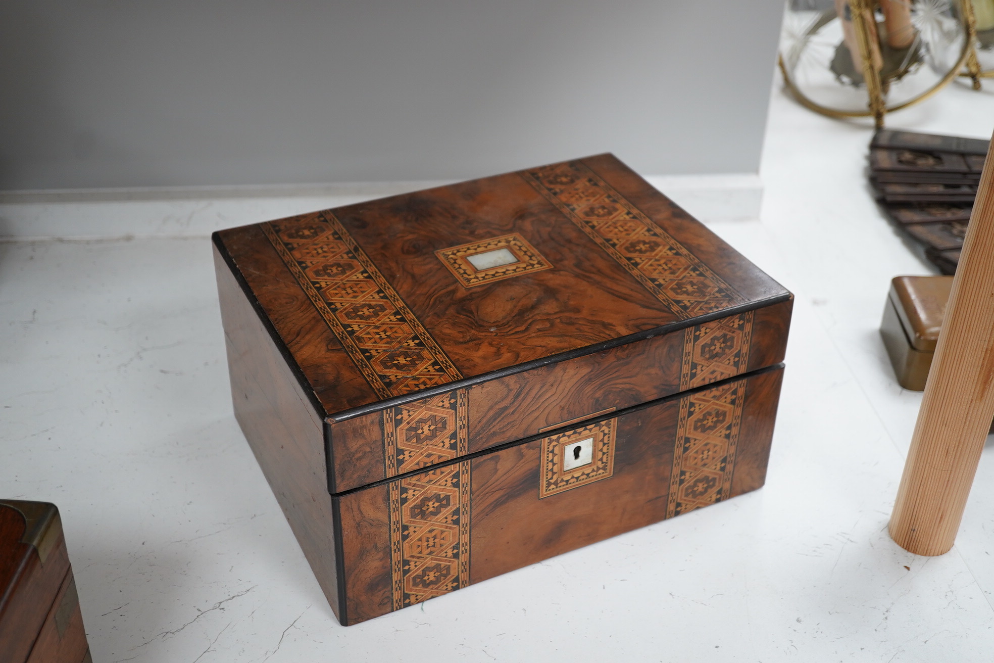 A mahogany brass mounted 19th century writing box and a walnut inlaid and mother of pearl writing box, brass mounted box, 35cm wide. Condition - exterior good, felt on slope torn.